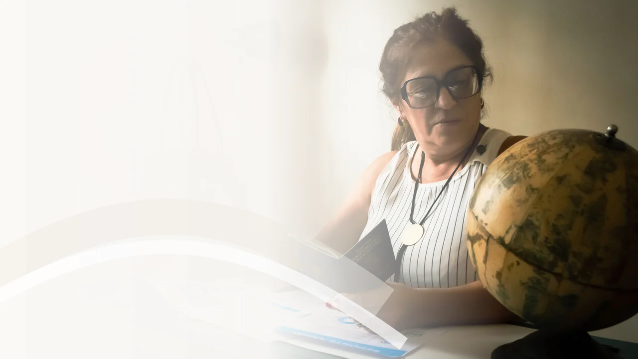Tax identification documents and passport prepared for ITIN application assistance